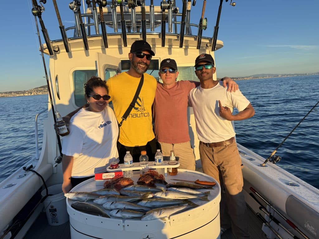 Family takes picture while fishing with Coast To Coast Sport Fishing beginner fishing charters san diego